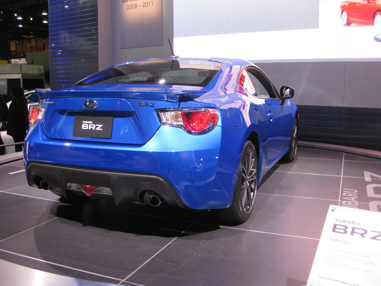Rear view of sporty coupe with dual exhaust and sleek taillights