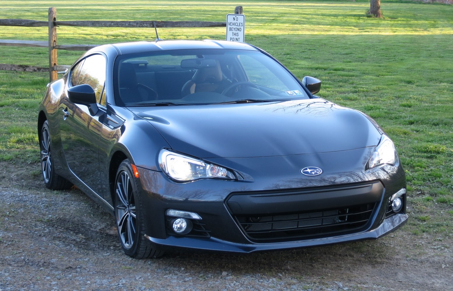 Front view of sleek sports coupe with LED headlights and black alloy wheels