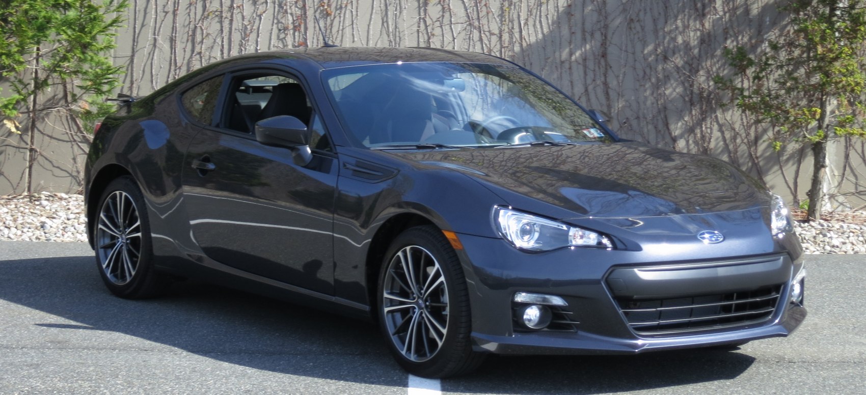 Sporty sleek coupe with distinct headlight and alloy wheels