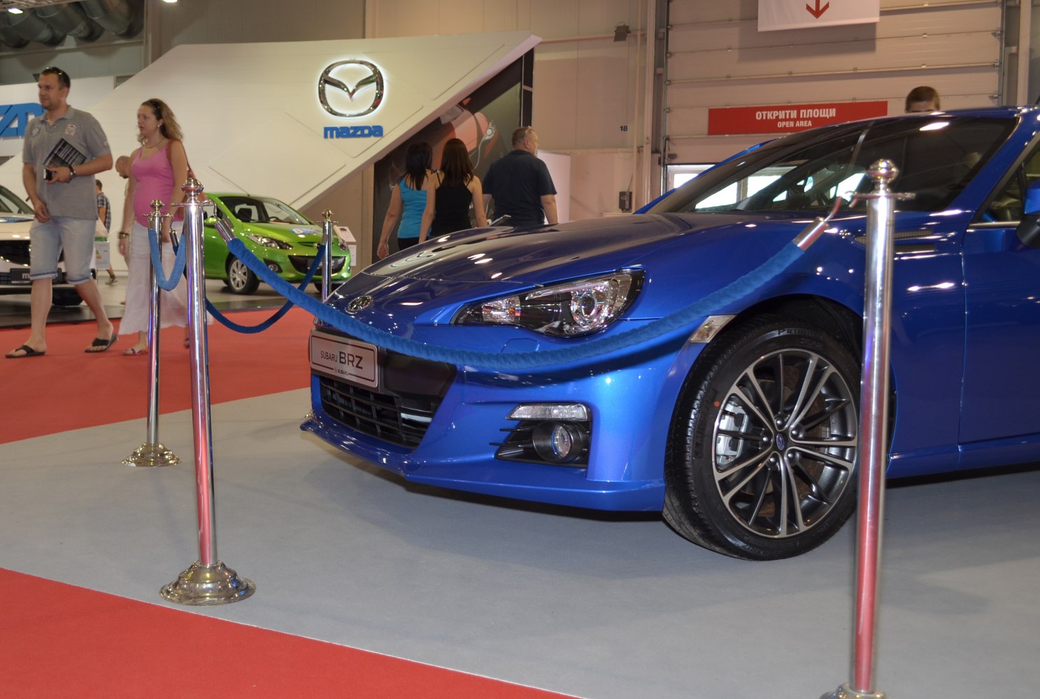 Front end view with headlight and alloy wheel detail