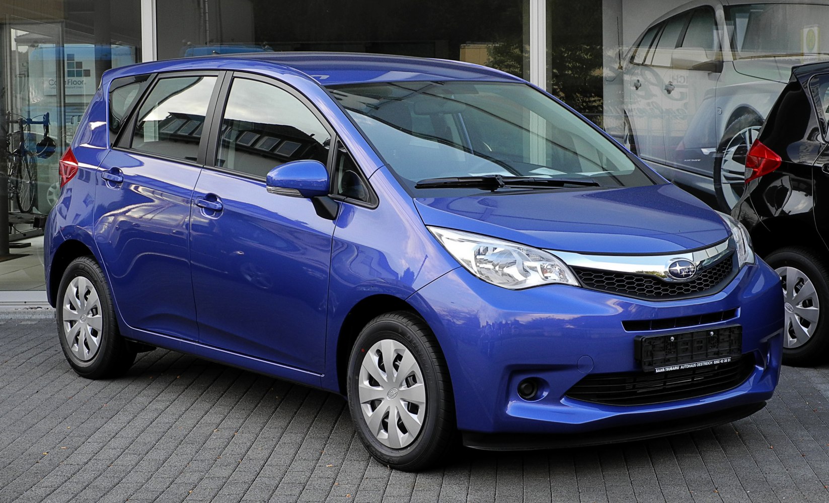 Blue compact 5-door hatchback front-side view