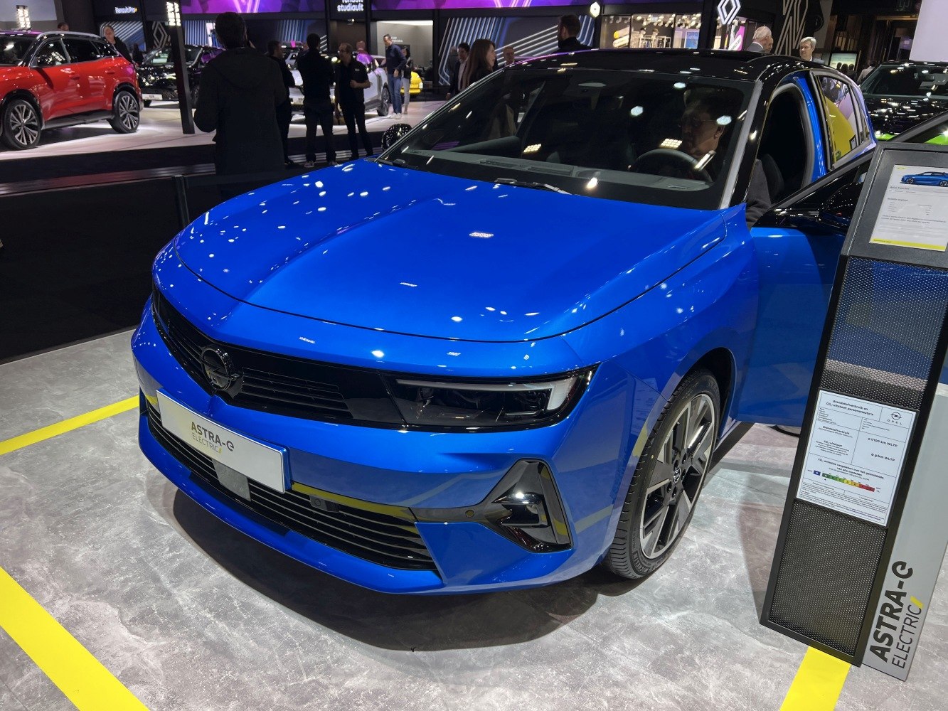 Electric compact hatchback with modern headlights and sleek front design