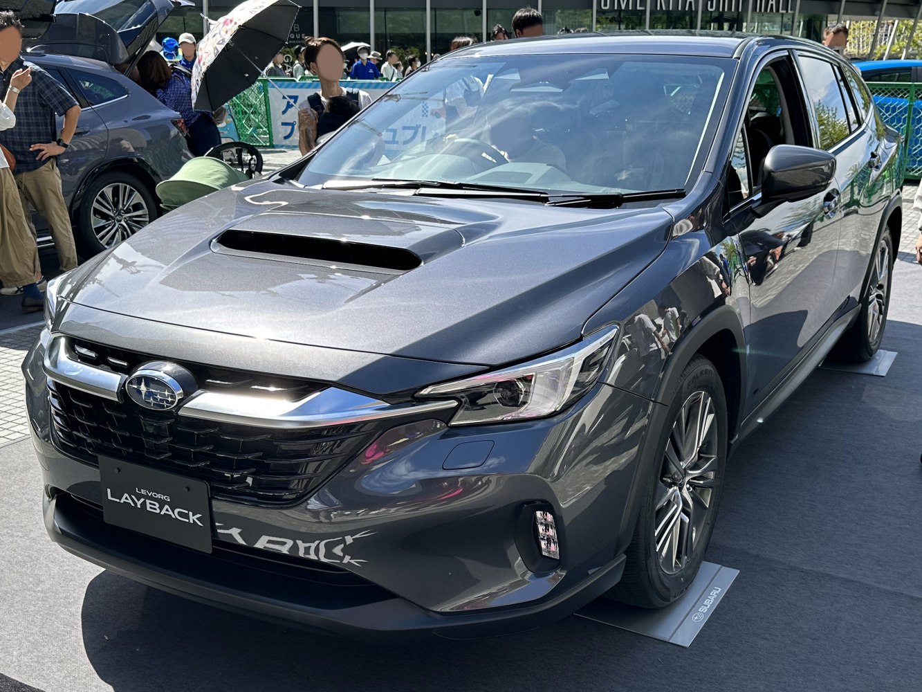 Hood scoop and LED headlights on front car view