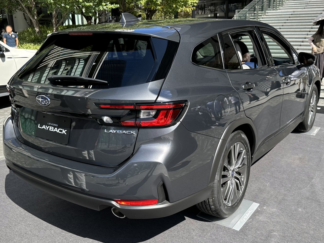 Rear view of modern hatchback with LED tail lights and sporty design