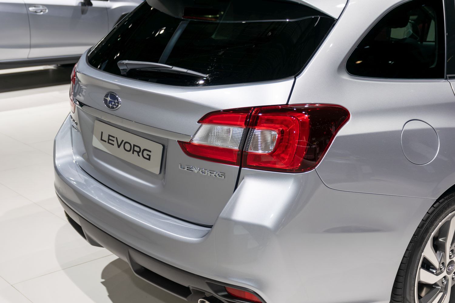 Rear section showing tail light and rear window with wiper