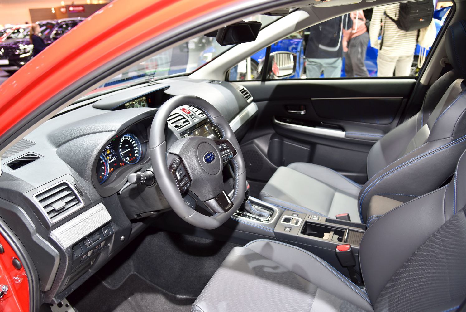 Dashboard, steering wheel, front seats, and controls interior view