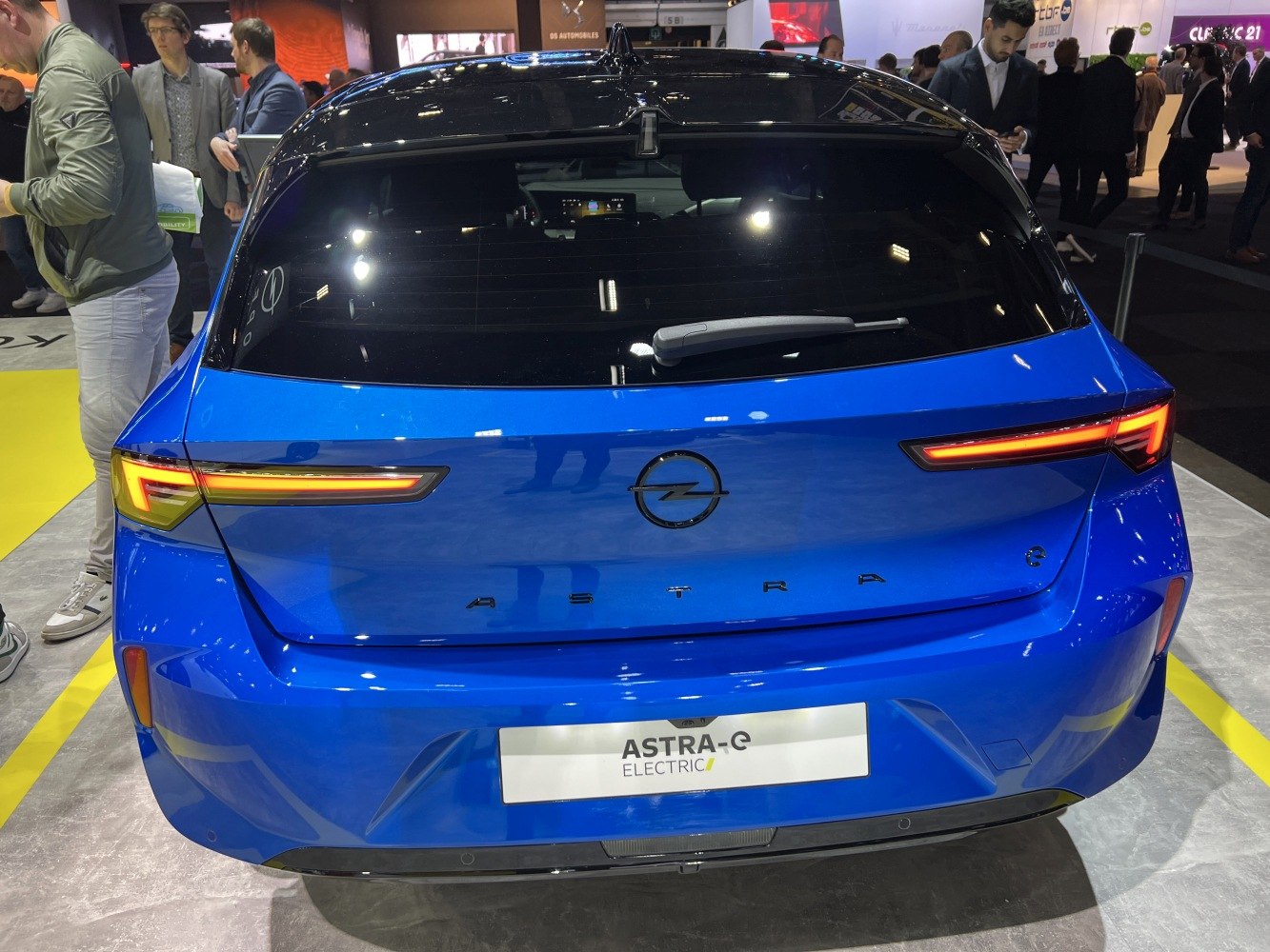 Rear view of blue hatchback with LED taillights and electric badging