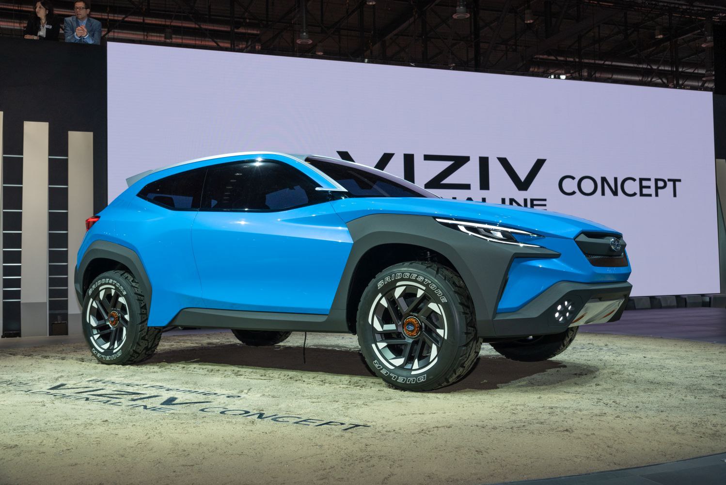 Blue sporty SUV with off-road tires and futuristic design