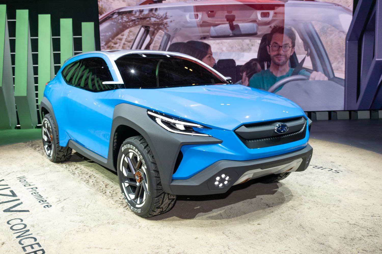 Blue crossover SUV with futuristic front fascia and LED headlights