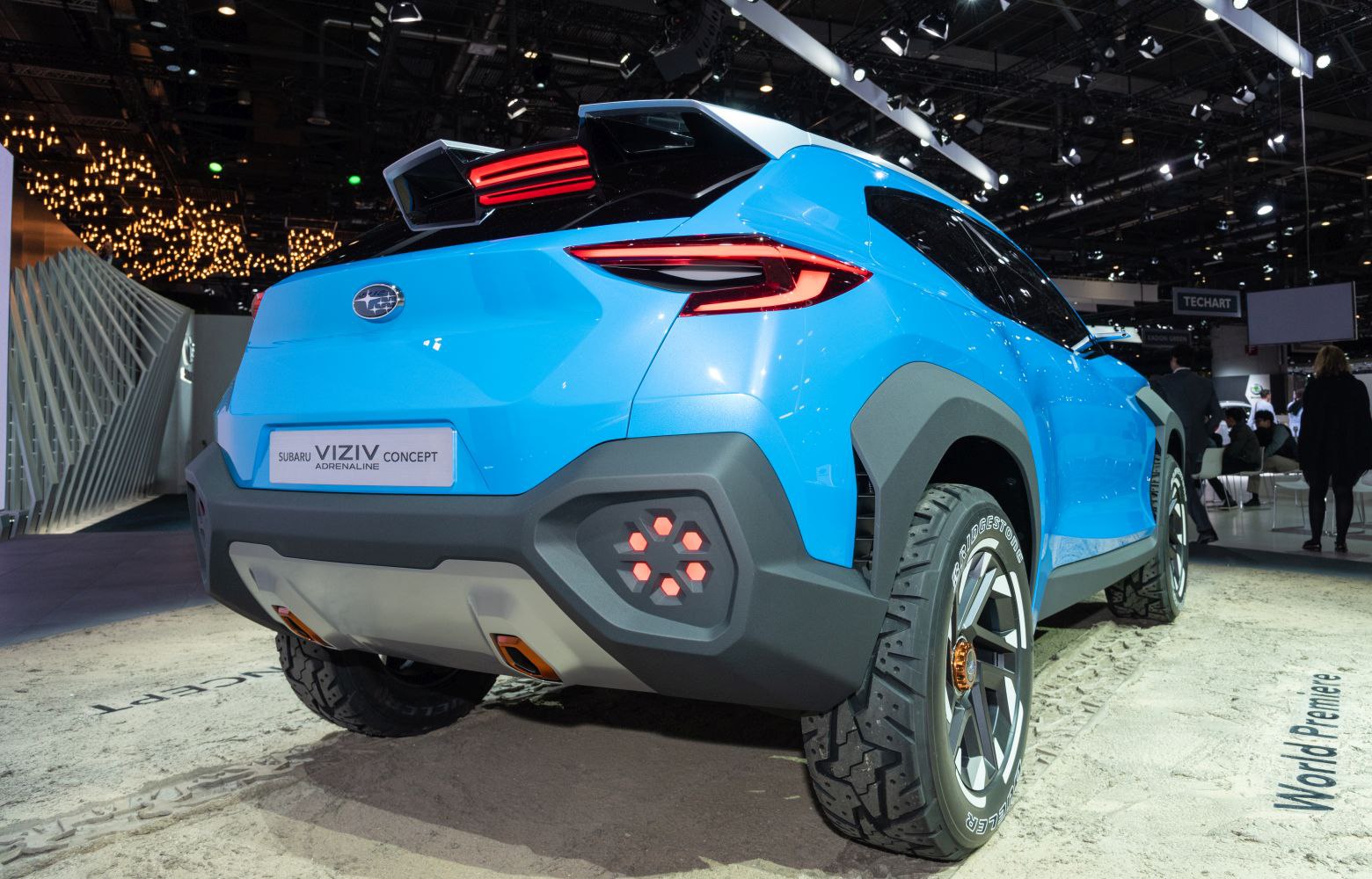 Futuristic rear design with distinctive taillights and rugged tires