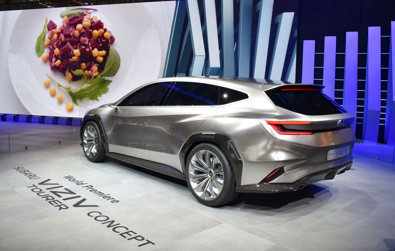 Rear three-quarter view of a futuristic concept car with large alloy wheels and sleek taillights