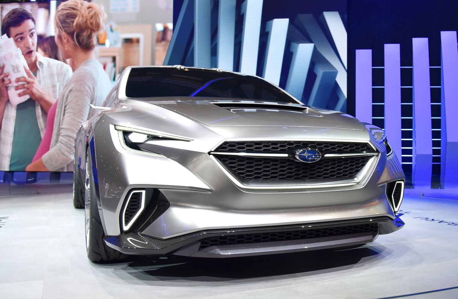 Futuristic front with sleek LED headlights and honeycomb grille