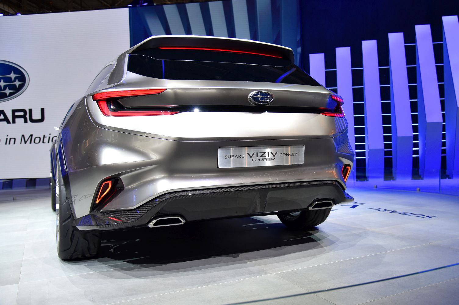 Futuristic rear design with sharp LED tail lights and dual exhaust tips.