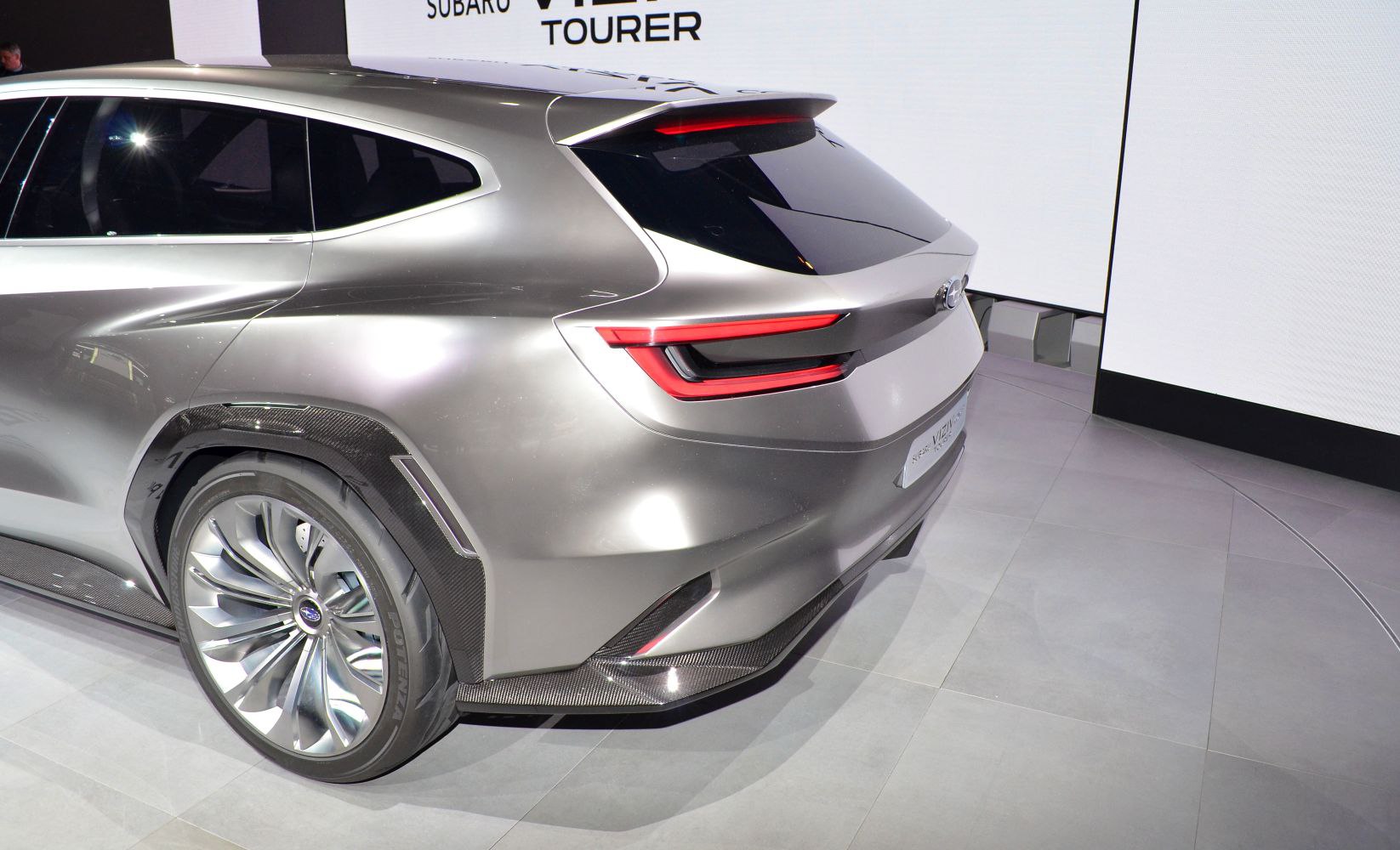 Sleek rear design with futuristic wheel and aerodynamic features