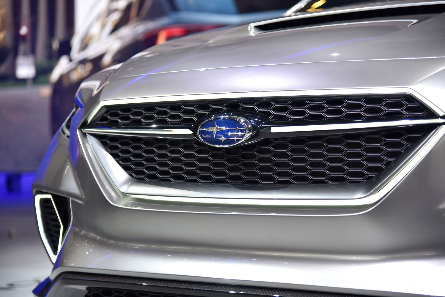 Close-up of hexagonal front grille with Subaru emblem