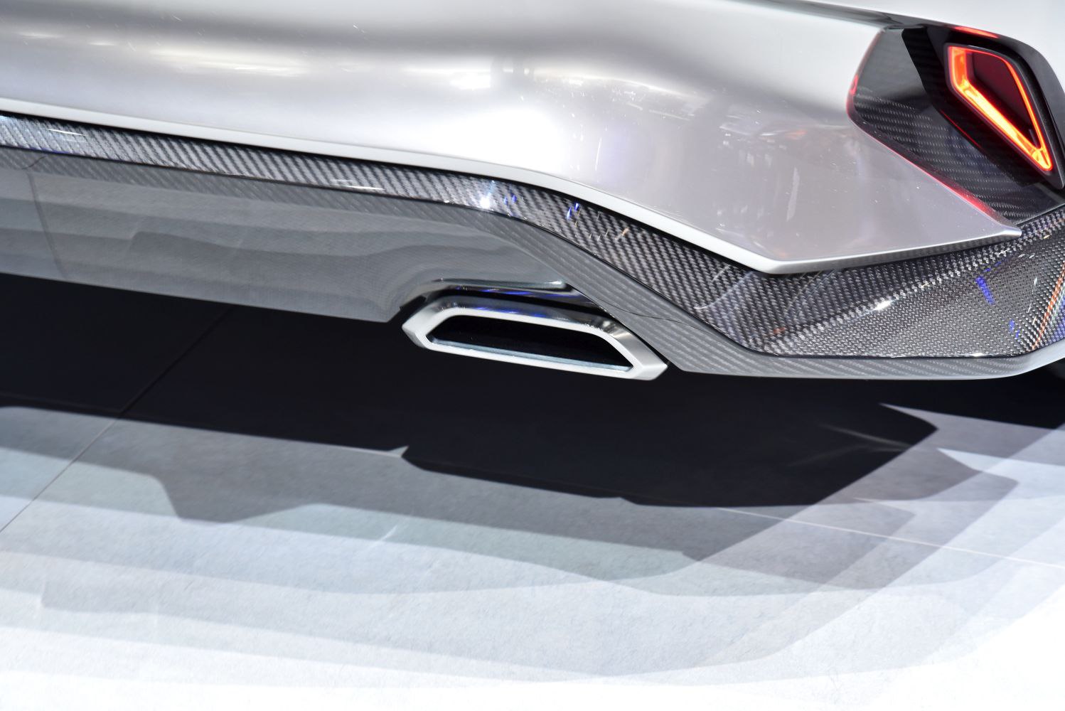 Rear exhaust tip and angular tail light with carbon fiber diffuser