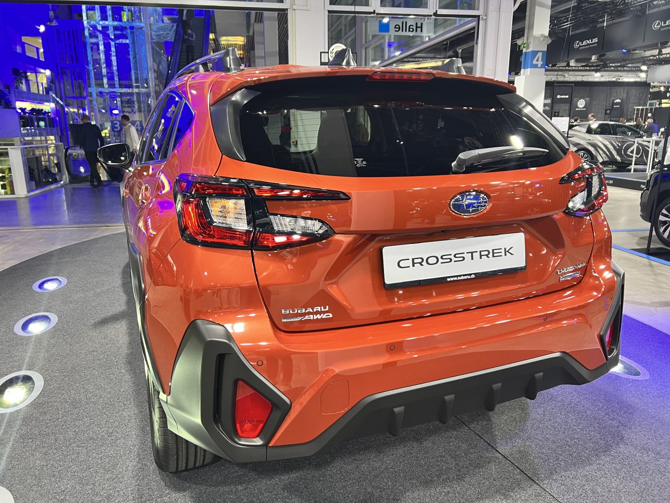 Rear view showing distinctive LED taillights and rugged bumper with diffuser