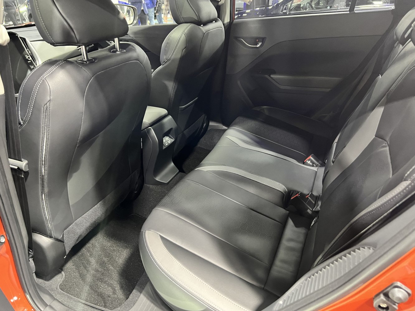Rear seat interior with black leather upholstery and spacious layout