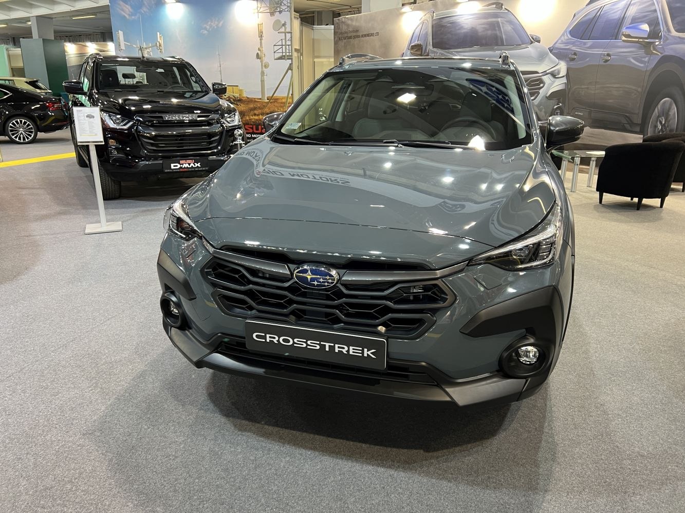 Front view of modern SUV grille, headlights, and fog lights
