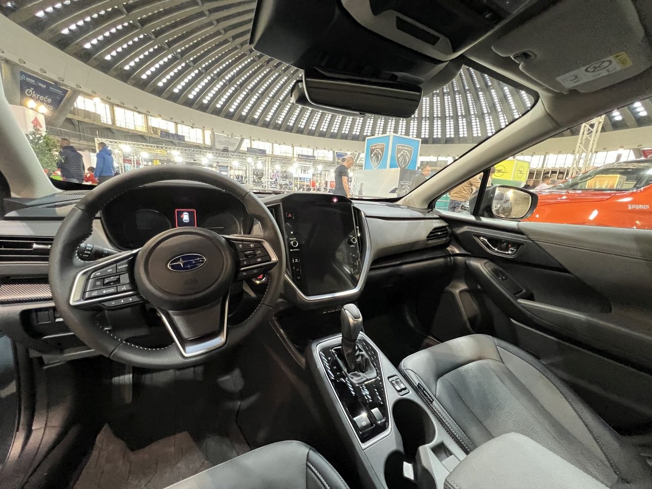 Modern dashboard and multifunction steering wheel with touchscreen.