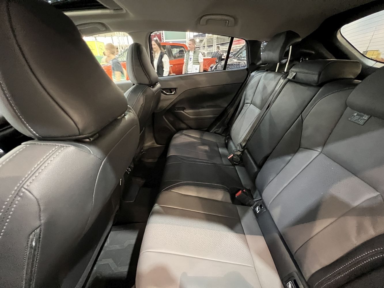 Modern rear seats with leather upholstery and seat belts
