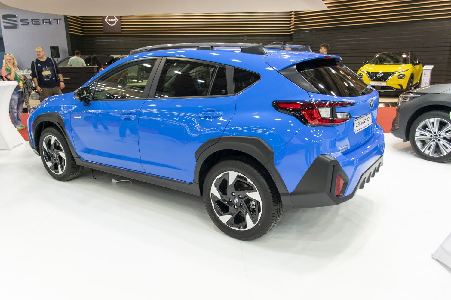 Blue compact SUV rear side with bold taillights and black cladding