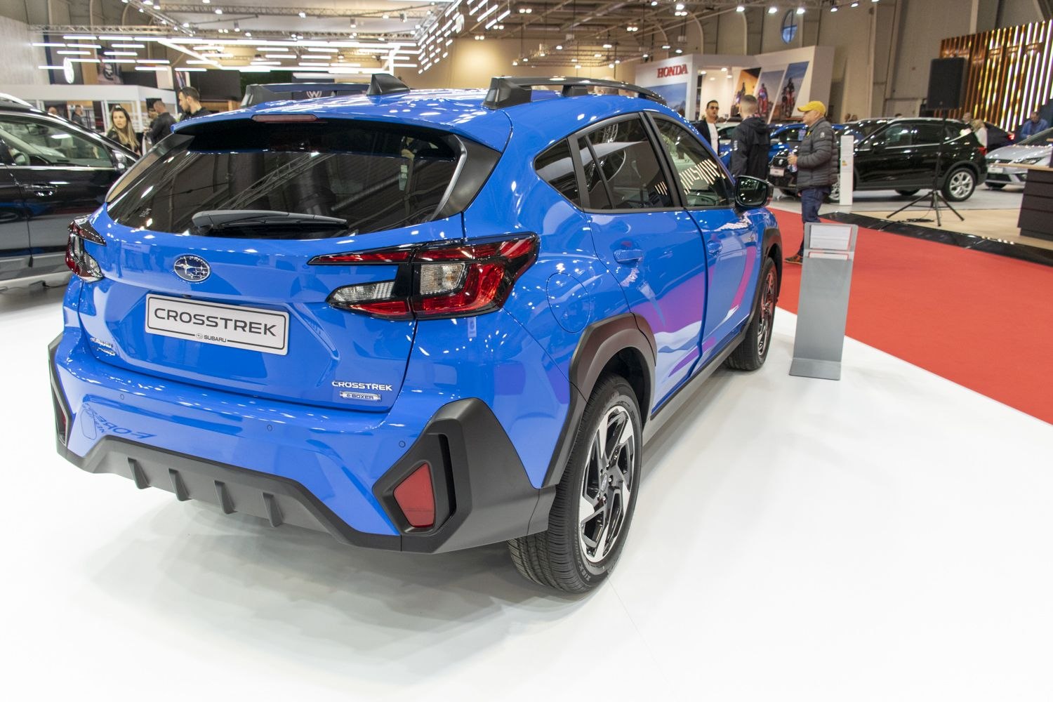 Rear view of compact SUV with LED tail lights and roof rails