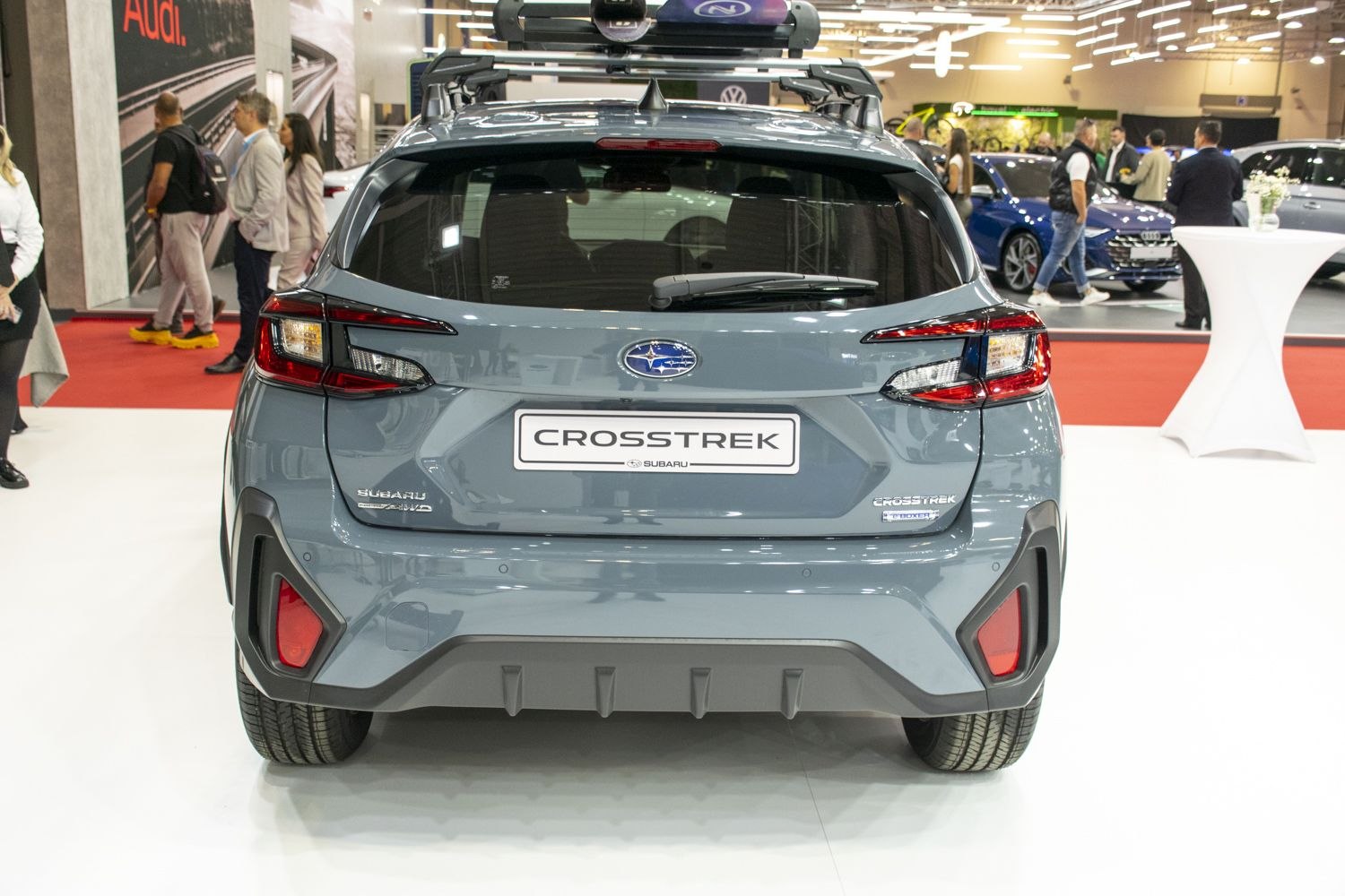 Rear view of modern SUV with distinctive taillights and roof rack