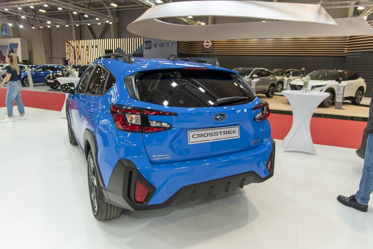 Blue compact SUV rear with distinctive taillights and roof rails