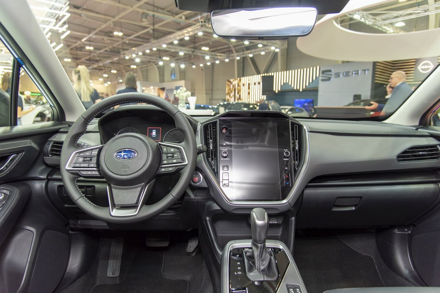 Modern car interior with touchscreen and multifunction steering wheel