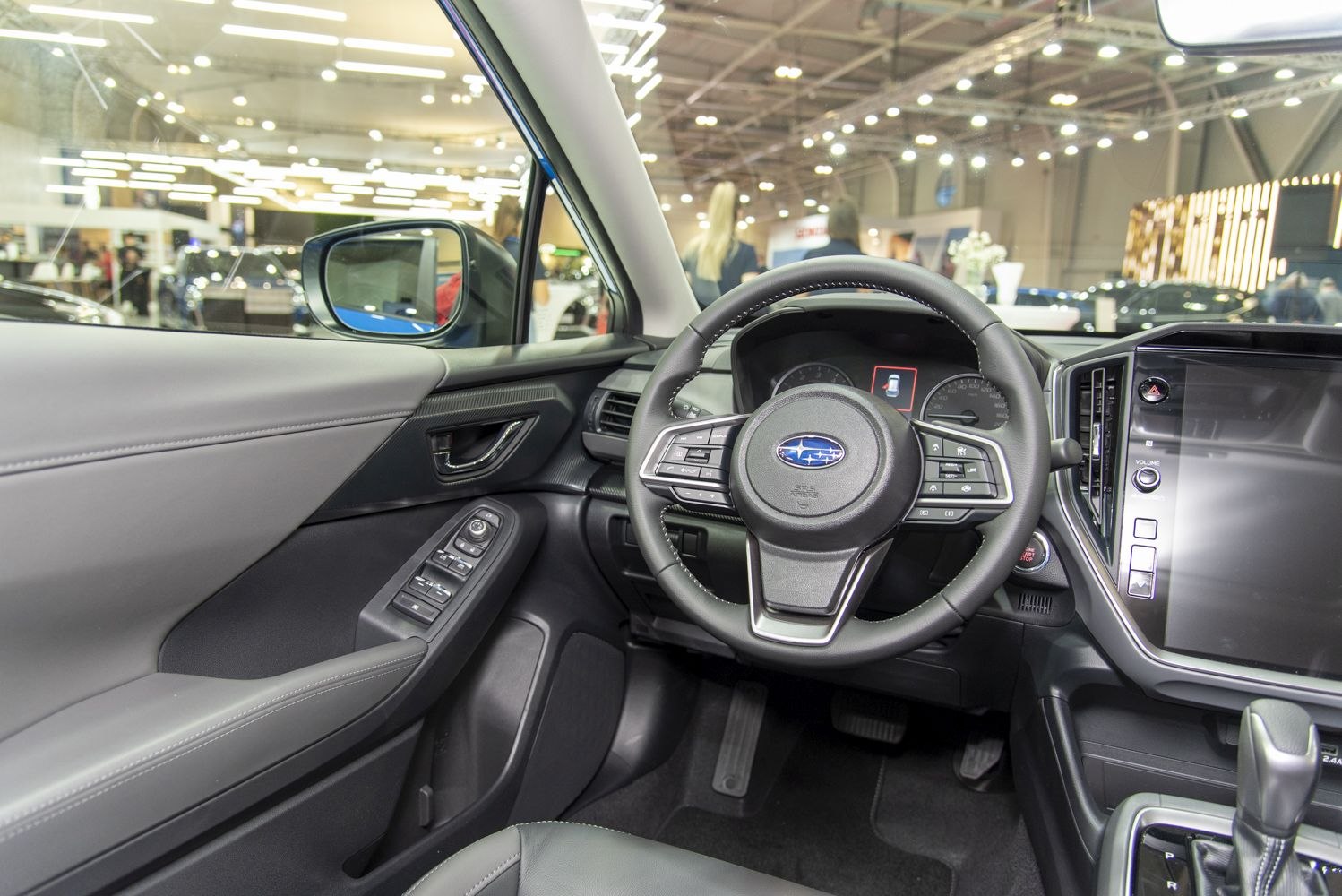 Modern steering wheel and dashboard with infotainment system control