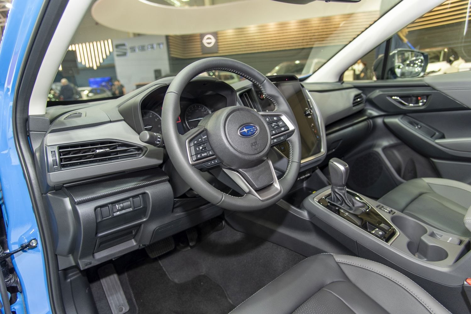 Steering wheel with integrated controls and center console with gear shifter