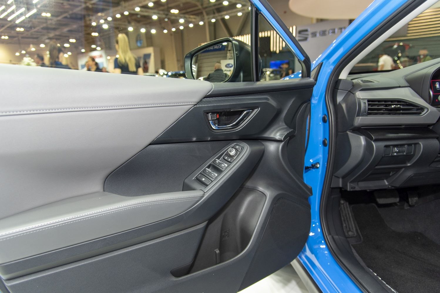 Modern interior door panel with control switches and door handle