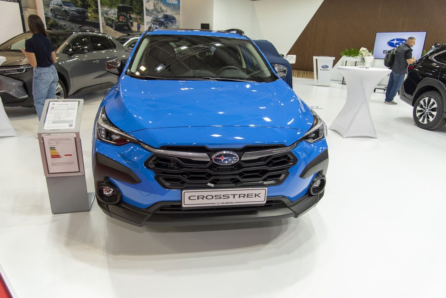 Bold front grille and sleek headlights of a blue SUV