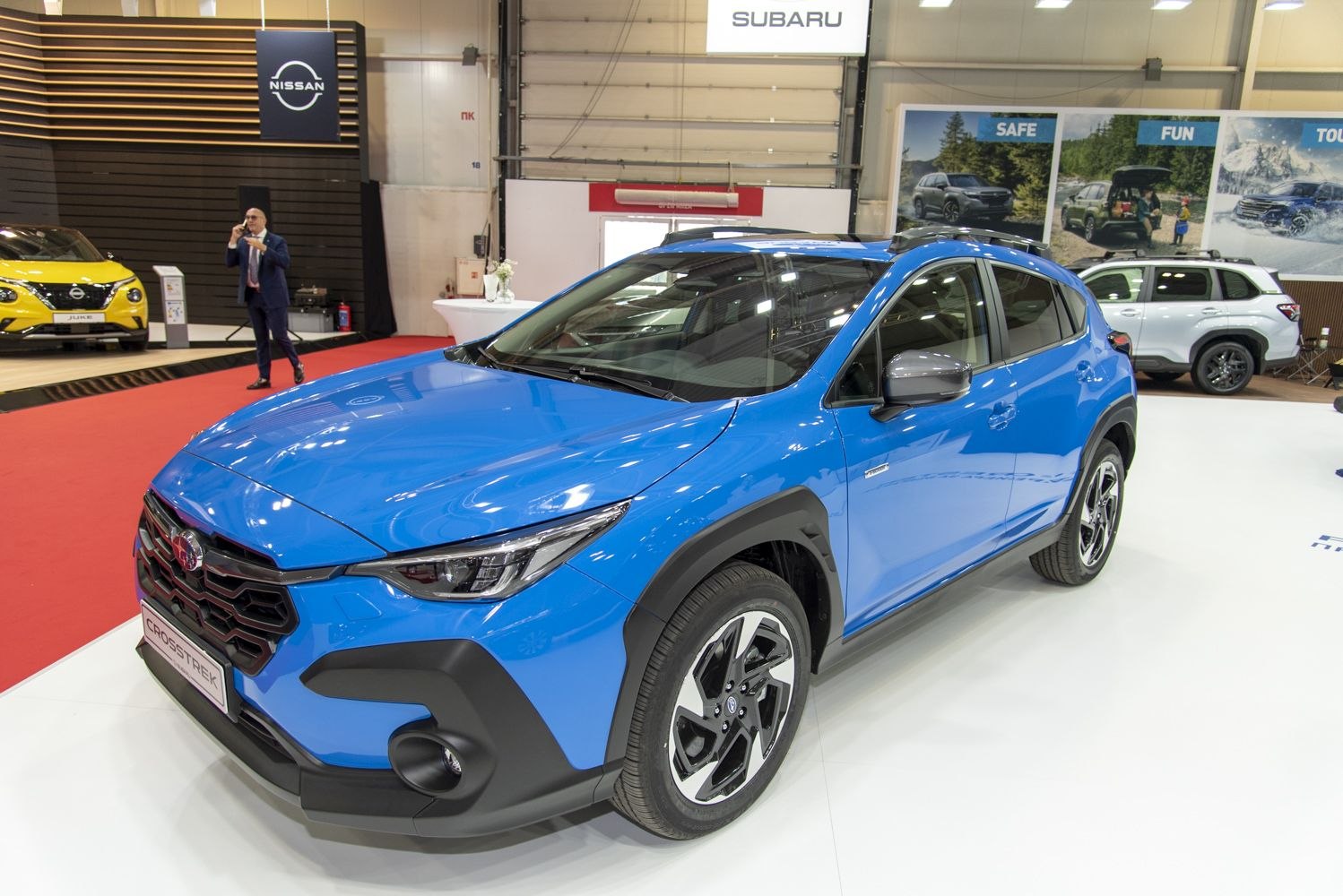 Blue SUV with bold front grille and modern LED headlights