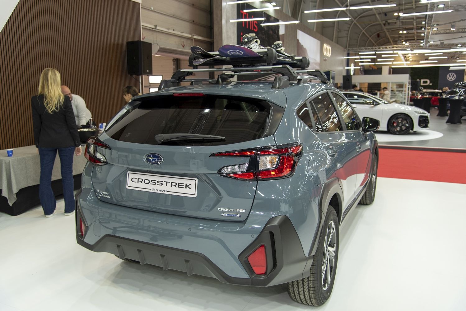 Rear view of 2024 SUV with roof ski rack and modern tail light design