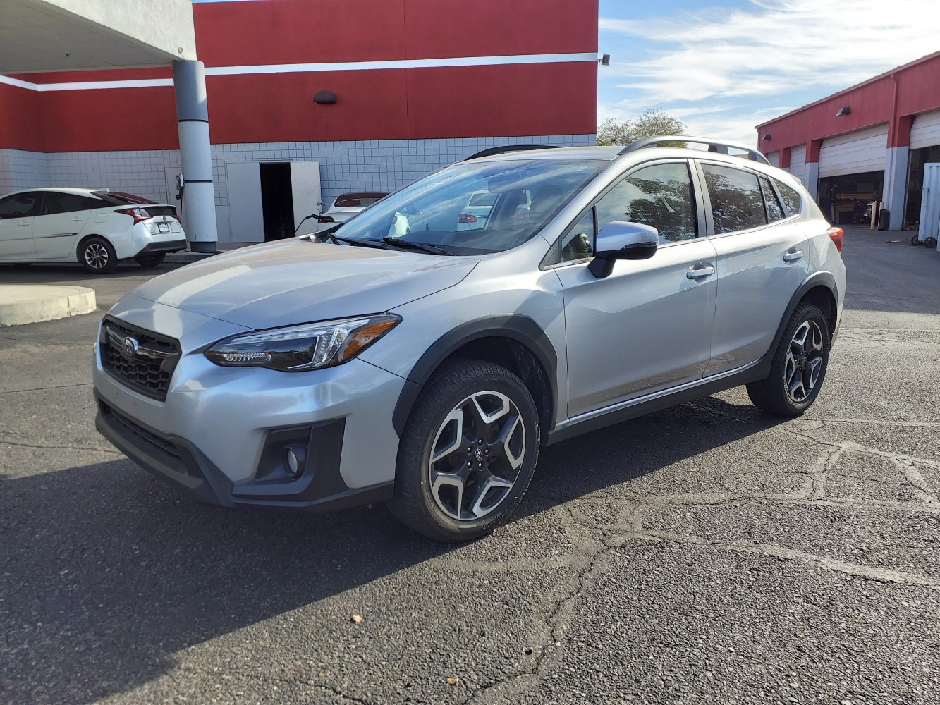Silver crossover SUV with alloy wheels and roof rails