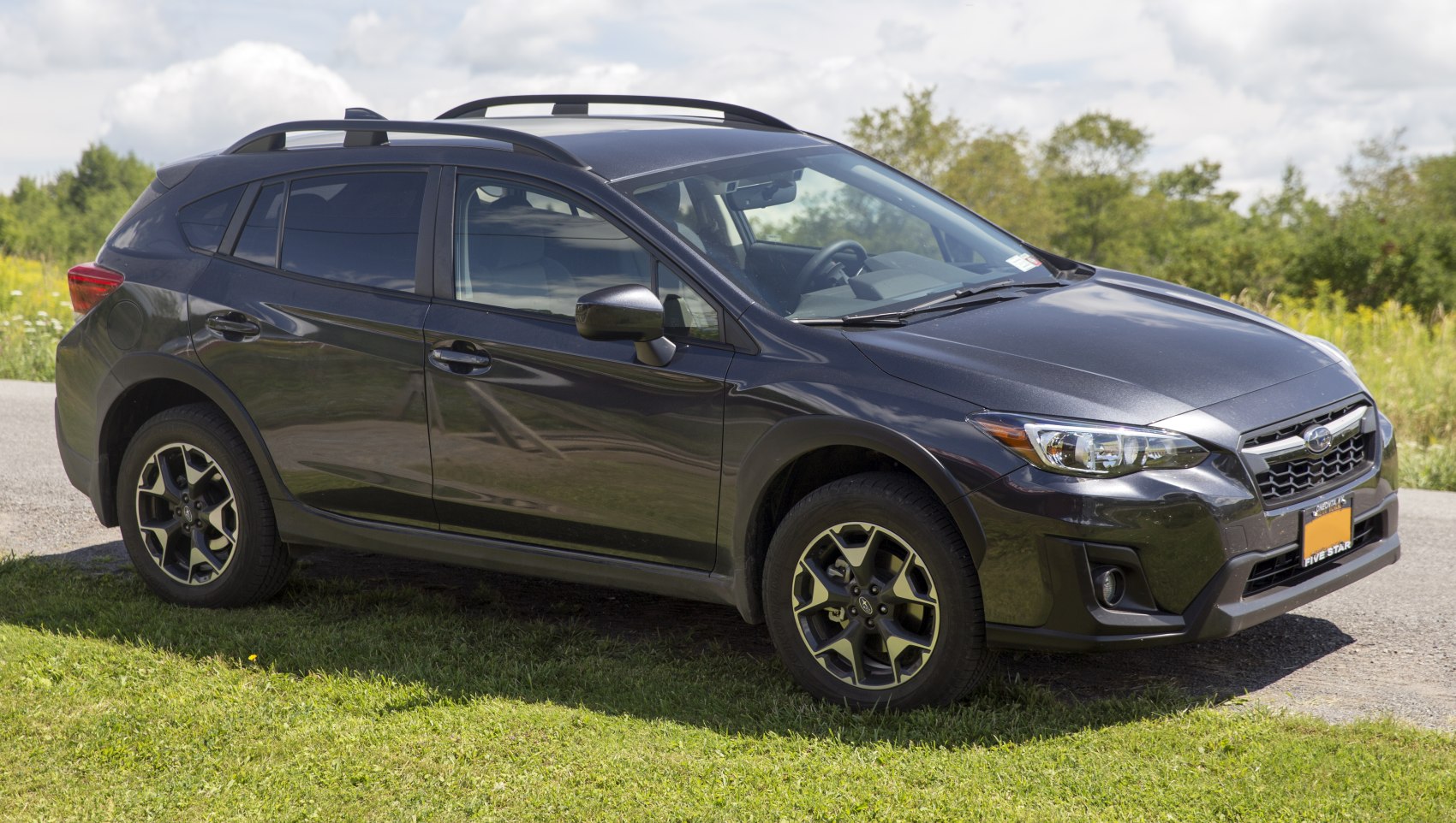 Side profile of crossover with roof rails and alloy wheels
