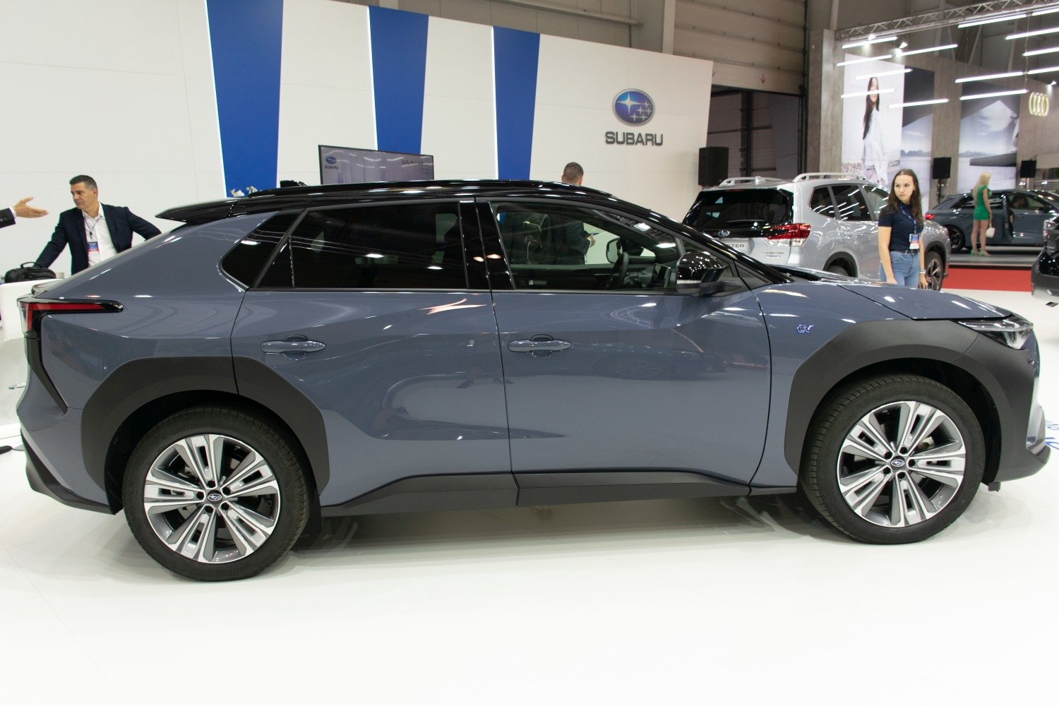 Side profile of modern SUV with dual-tone paint and alloy wheels
