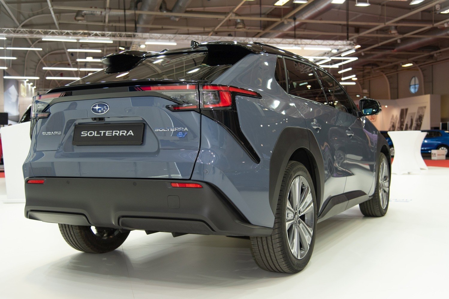 Rear view of electric SUV with distinct LED tail lights and alloy wheels