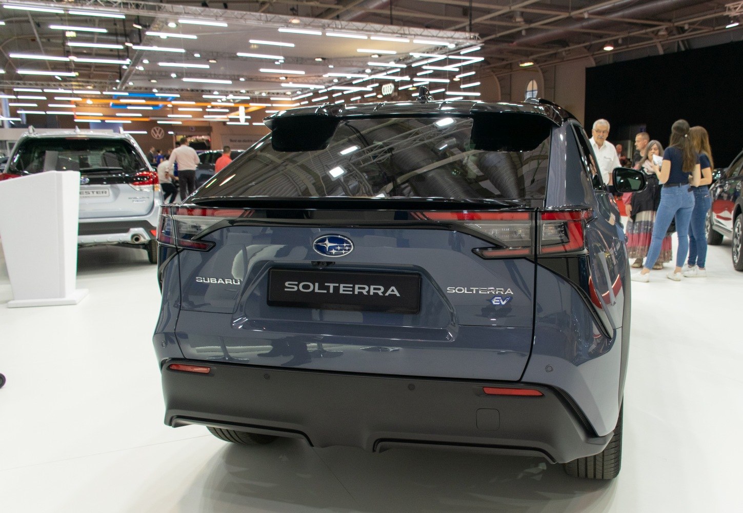 Rear view of a sleek electric SUV with modern taillights and rear bumper design