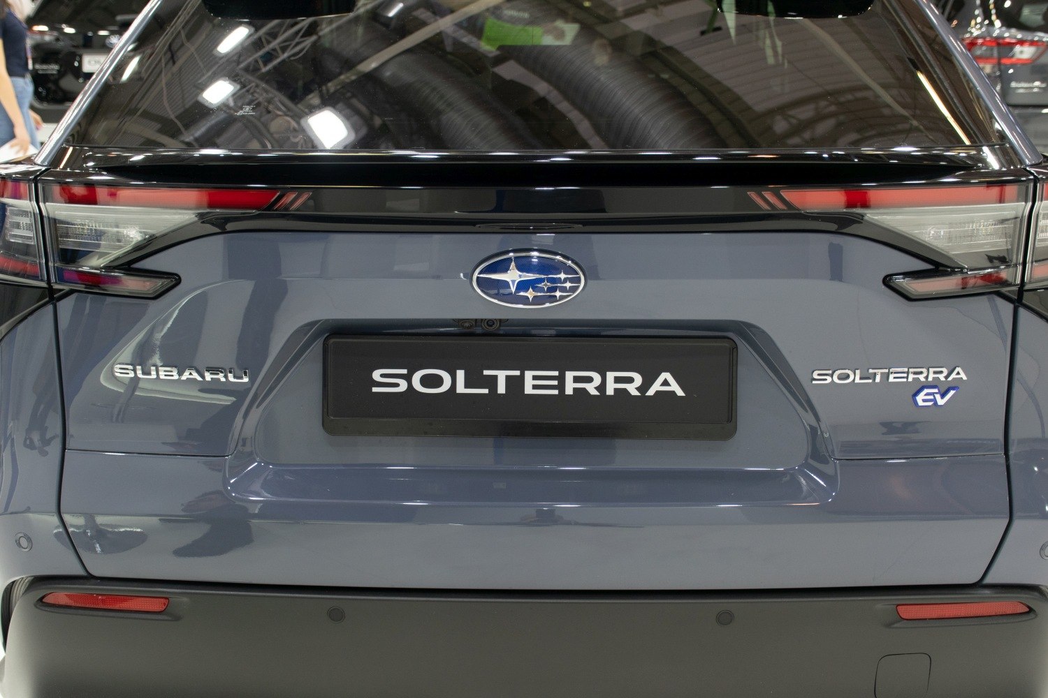 Close-up of rear with taillights, Subaru logo, Solterra and EV badges