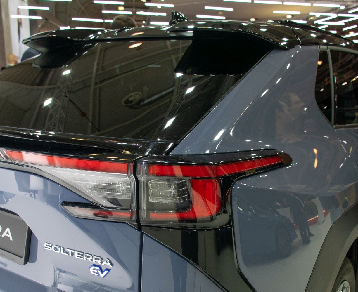 Close-up of rear tail light and EV badge on electric SUV