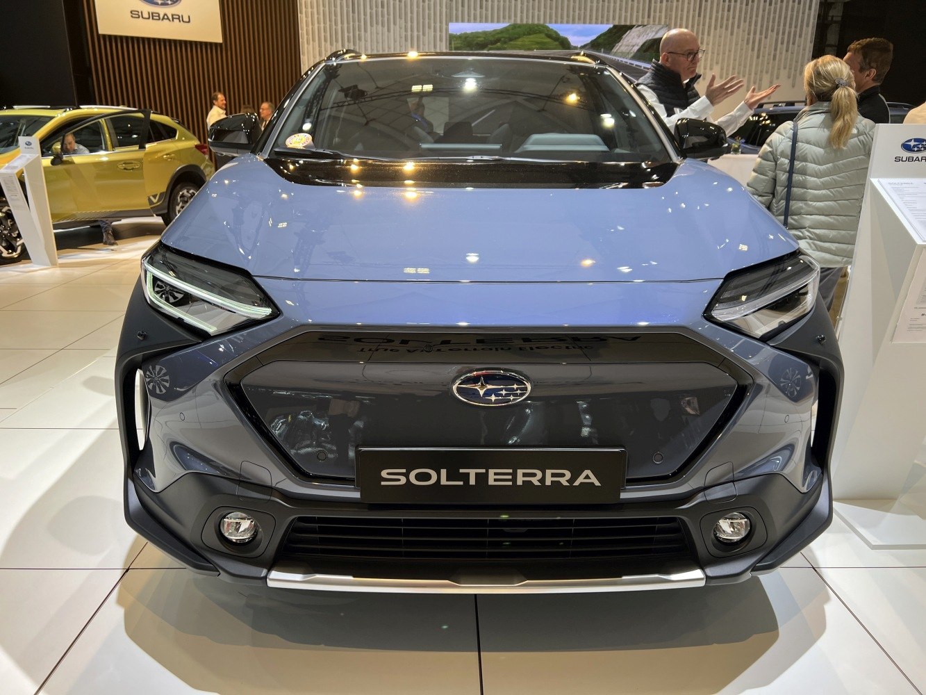 Front view of electric SUV with LED headlights and modern grille design