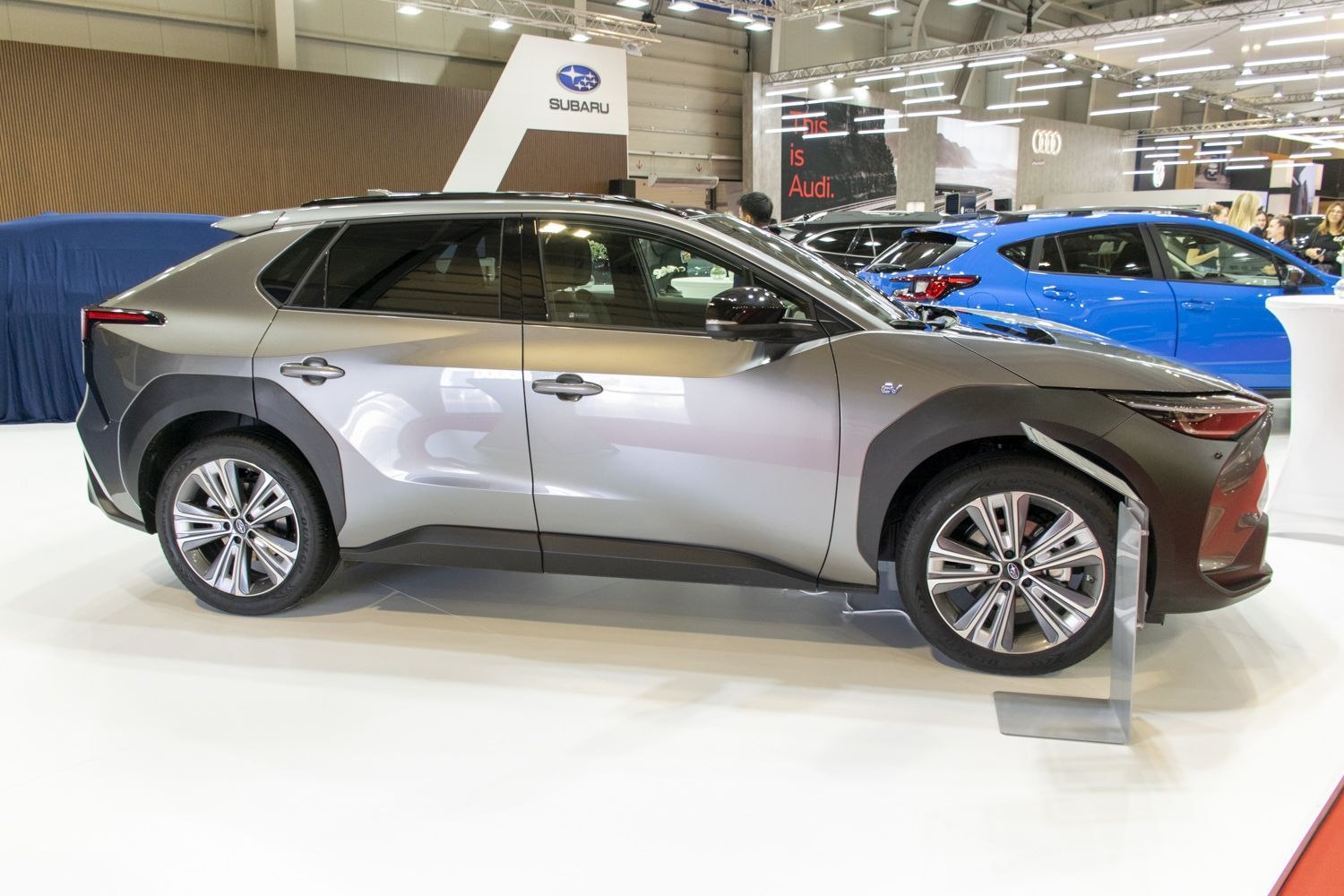 Sleek electric SUV side profile with alloy wheels and modern design