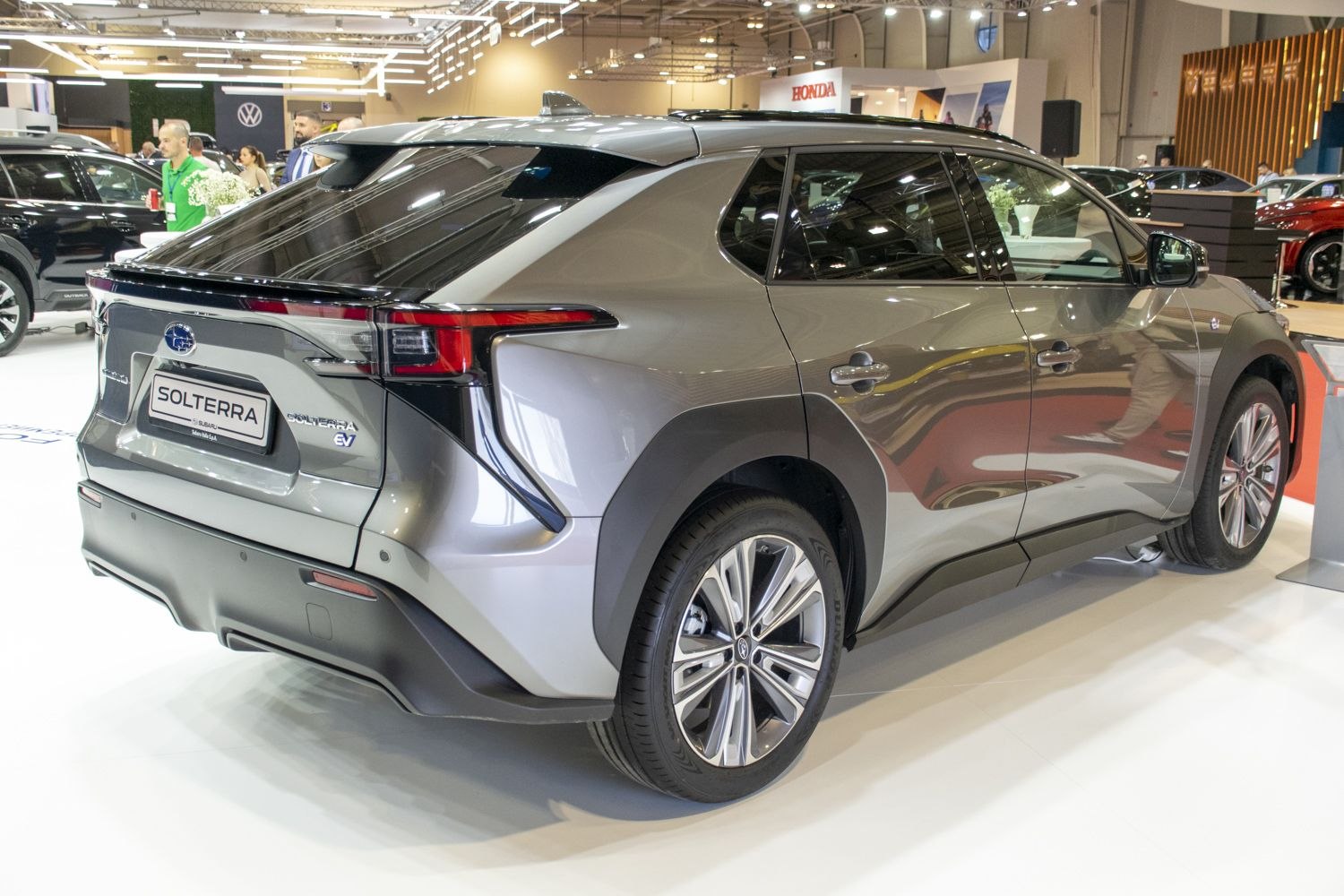 Rear and side profile of an electric SUV with alloy wheels and modern tail lights.
