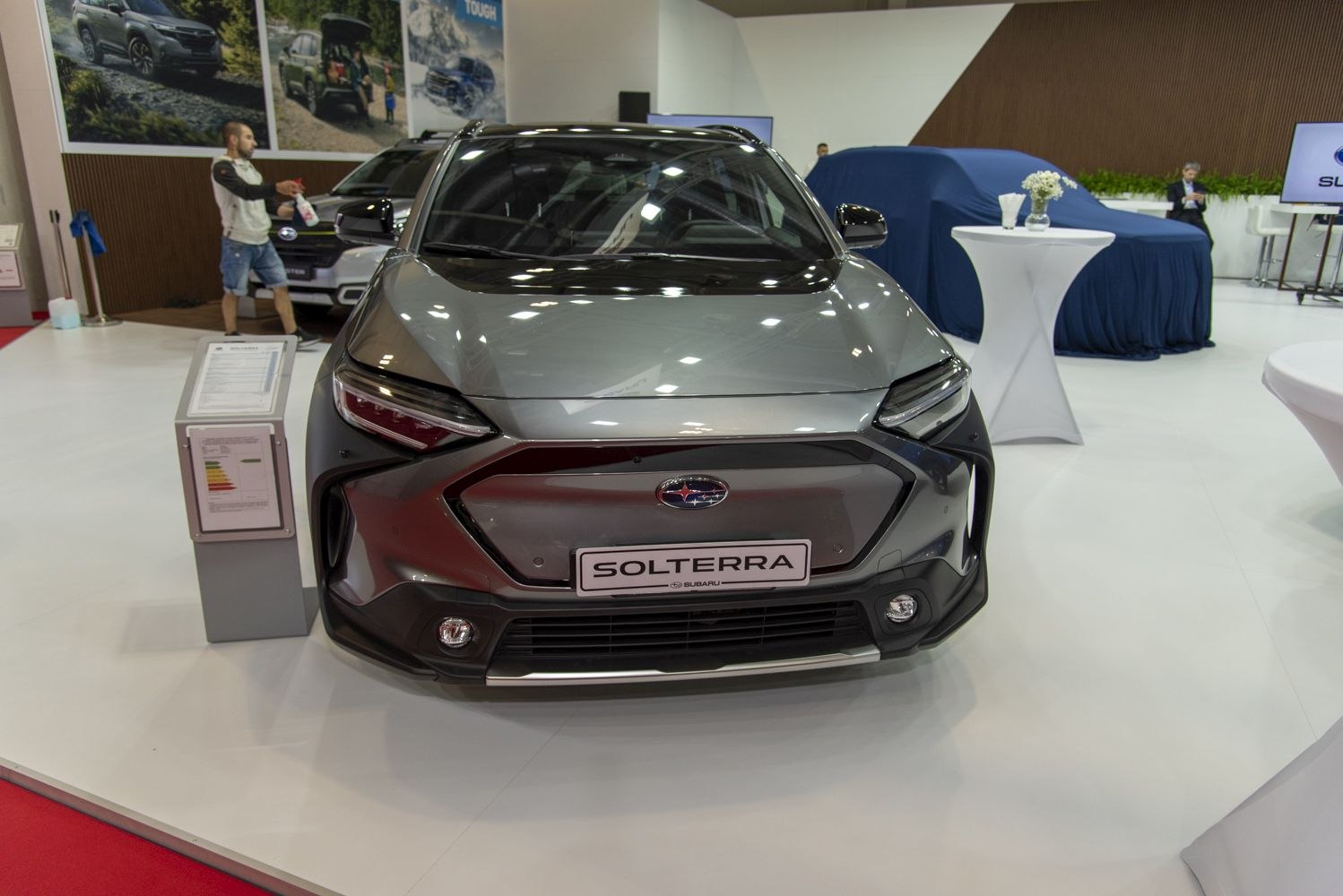 Front view of a modern SUV with sleek angular headlamps and closed grille.