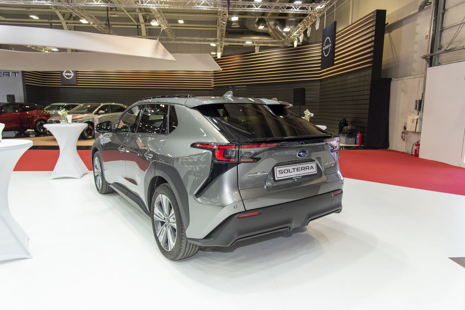 Rear view of a modern electric SUV with sleek taillights and aerodynamic styling