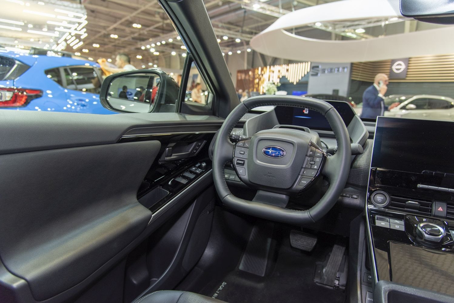 Modern electric SUV interior with digital dashboard and multifunction steering wheel