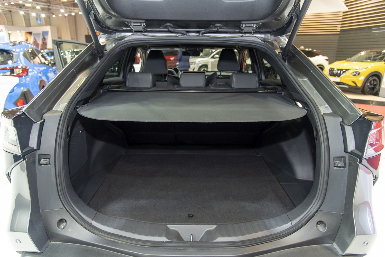 Ample spacious trunk with cargo cover and rear seats visible